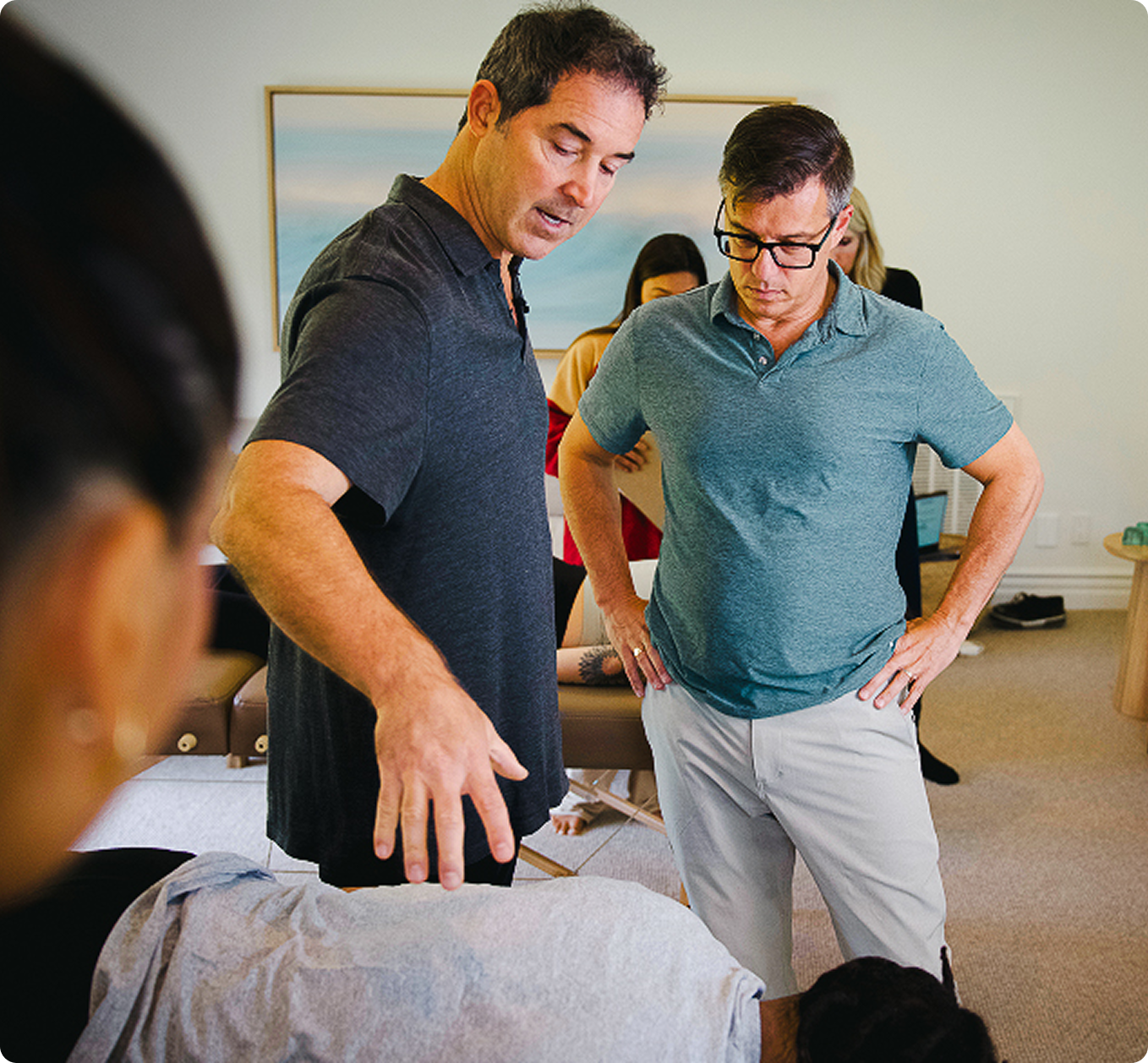 Practitioners with a client during a session